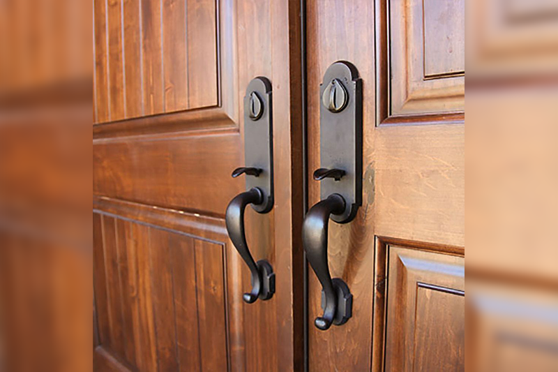 A pair of doors with handles and knobs.