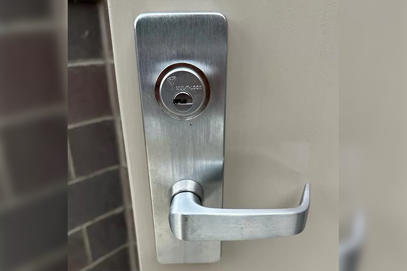 A door handle with a key hole and a lock.