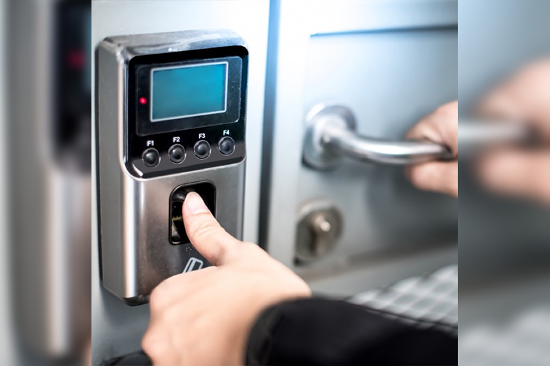 A person is using the electronic lock to open it.