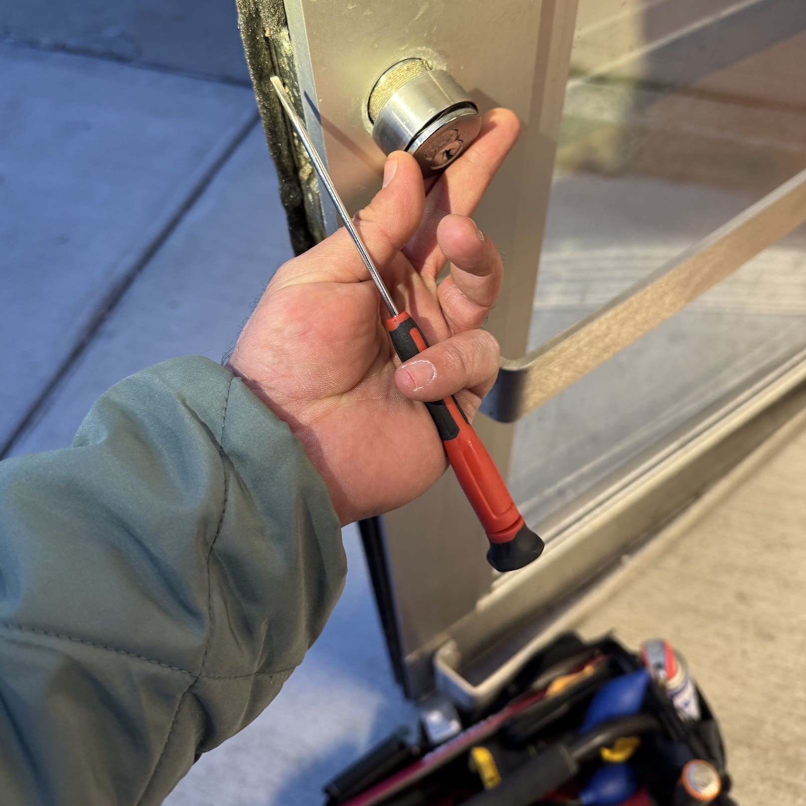 A person holding onto some keys to the door of their car.